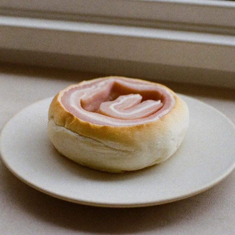 A bacon roll on a plate